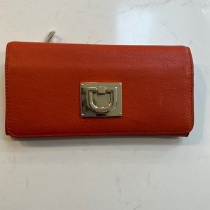 Next to new orange DKNY wallet